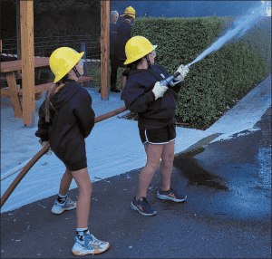 The juniors getting experience with the fire hoses and their different pressures. 