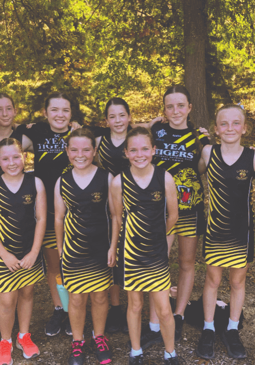 Yea Netball under 13 team for 2024 with their coach Lauren Cronk.