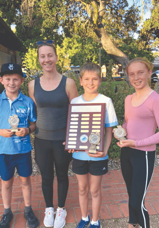 swim (2) The junior squad of Chase, Magenta (their coach), Declan, and Abby.