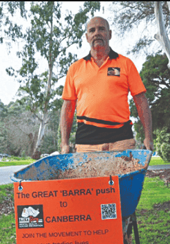 Trevor pushing his barrow to Canberra Trevor pushing his barrow to Canberra