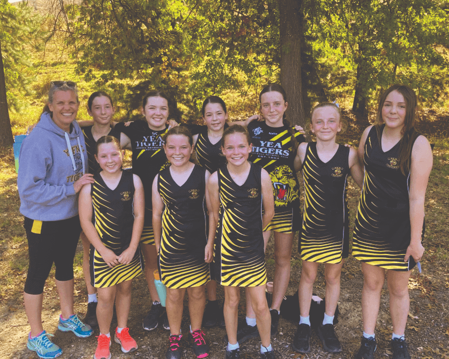 Yea Netball under 13 team for 2024 with their coach Lauren Cronk.