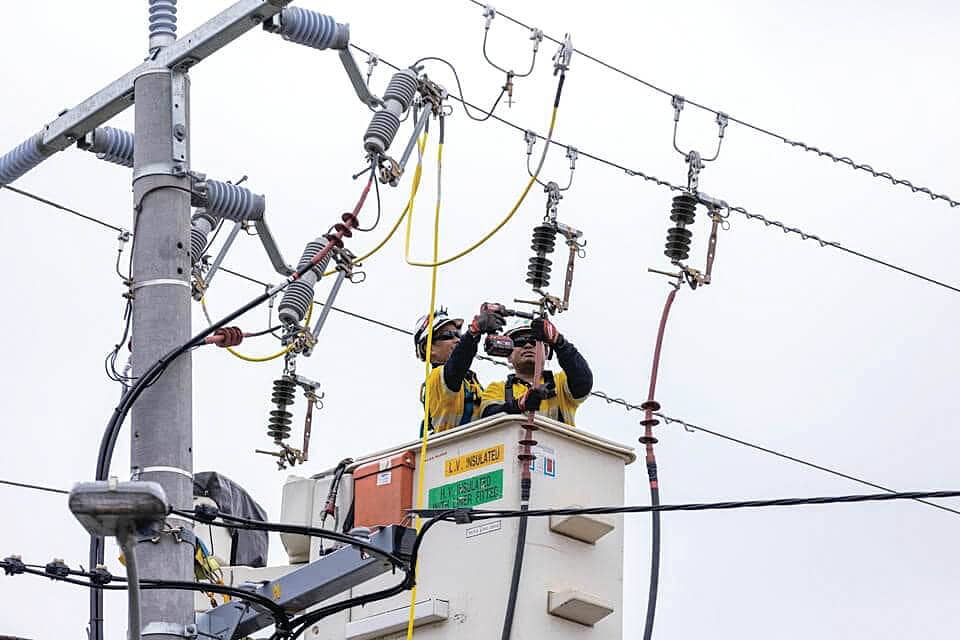 Ausnet technicians fixing powerlines following the storms on Tuesday, February 13.
