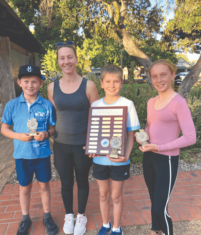 The junior squad of Chase, Magenta (their coach), Declan, and Abby.